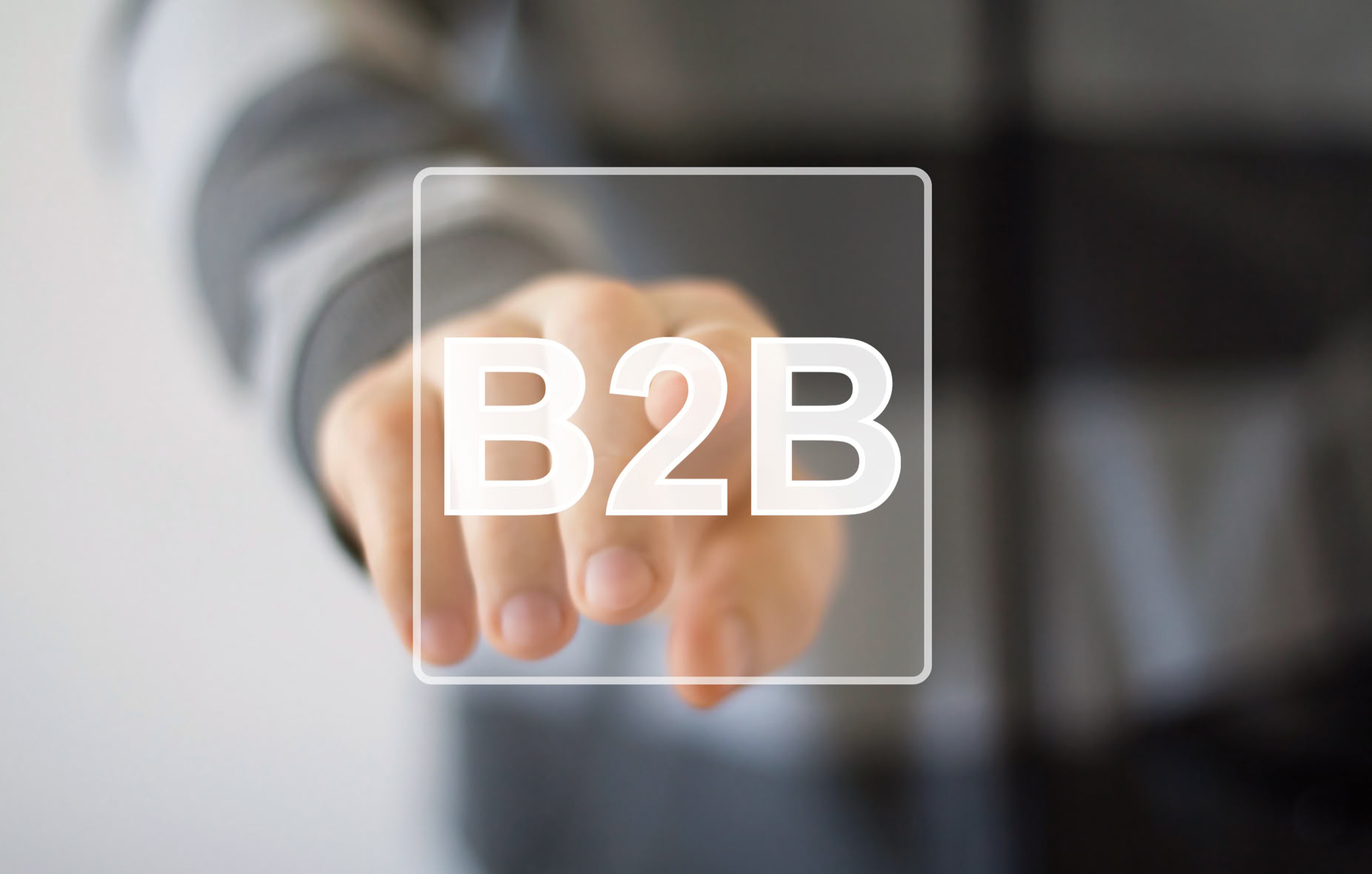 Finger zeigt auf ein transparentes Quadrat mit der Aufschrift "B2B".